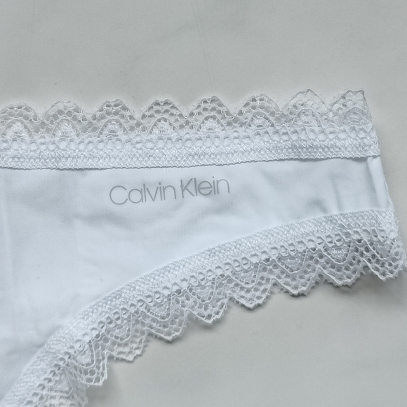 NWT CALVIN KLEIN FLIRTY MICRO THONG PANTY IN WHITE SIZE EXTRA LARGE - Picture 3 of 5